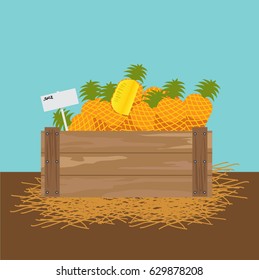 pineapple in a wooden crate