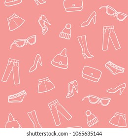 Pink background with a fashion icons. Trendy clothes, shoes and accessories