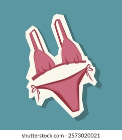 Pink bikini illustration in a playful sticker style with shadow effect, placed on a teal background. Concept of summer, fashion, and swimwear. Vector illustration