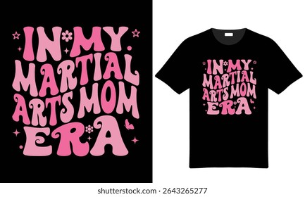 Pink and black t-shirt design featuring retro-style typography that reads In My Martial Arts Mom Era. Includes small graphic elements like a butterfly and