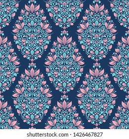 Pink and blue floral seamless pattern with decorative stripes. Traditional oriental motifs. Vintage ornament template. Paisley elements. Great for fabric and textile.
