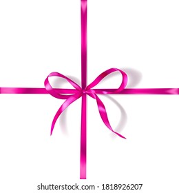 Pink bow made of narrow crosswise ribbon with shadow on white background. Criss-cross arrangement