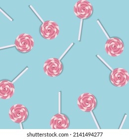 Pink candy pattern on blue background. Vector illustration