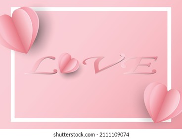 The pink card for valentine's day .There is a white frame with a paper heart shape overlaid and  a love message placed in the middle.