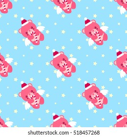 Pink Christmas teddy bear with lollipop pattern. Santa's hat. New Year gift.
