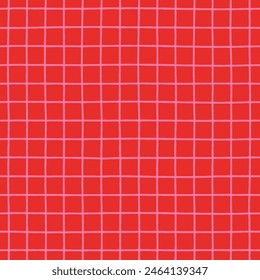 Pink crossed lines grid on red background seamless vector pattern. Hand-drawn check pattern. Bold and bright trendy plaid design. Hot pink stripes on a vibrant red background. Abstract geometric grid.