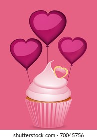 Pink cupcake with three heart shaped balloons