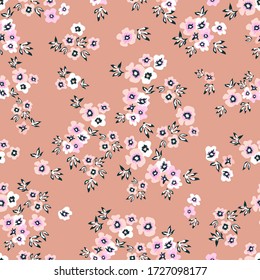 Pink ditsy fabric. Trendy fabric pattern with small flowers. Botanical seamless print with different floral elements. Vintage textile collection.