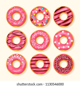 Pink donut with different topping on white background