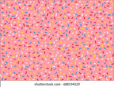  Pink donut glaze or ice cream top with many decorative sprinkles.