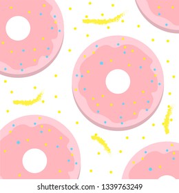 pink donut with icing and candy on a yellow background pattern