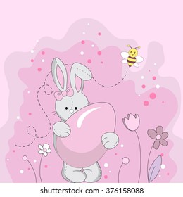 Pink Easter bunny holding a sugar egg