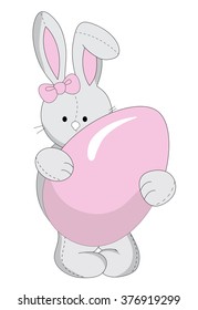 Pink Easter bunny holding a sugar egg