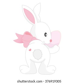 Pink Easter bunny holding a sugar egg