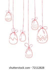Pink eggs hanging on threads