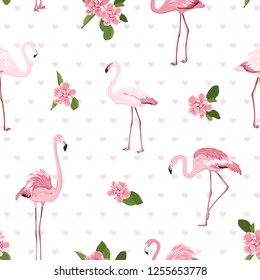 Pink exotic flamingo birds, bright tropical camelia flowers, green leaves and hearts on white background. Stylish seamless pattern for fashion, fabric, textile, decoration. Vector design illustration.