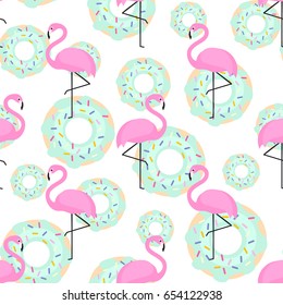 Pink flamingos and donuts trendy seamless pattern on white background. Exotic art background. Design for fabric, wallpaper, textile and decor.