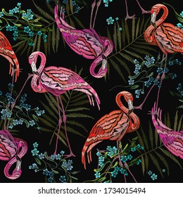 Pink flamingos and meadow flowers Tropical birds. Summer seamless pattern. Fashion animals background. Template for design of clothes 