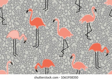 Pink flamingos on grey grunge background. Seamless animal print with tropical motifs. Trendy design for textile, cards, covers and other decorations.