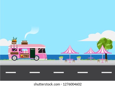 Pink food truck made from van with road and dining table on sea and sky background.