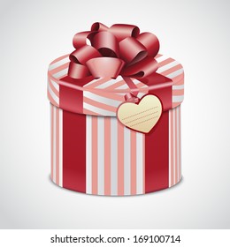 Pink gift striped box with ribbon and label for your message