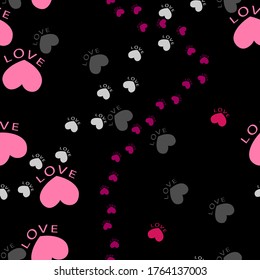 Pink and gray paw marks on a black isolated background. Seamless pattern for fabric, wallpaper, wrapping paper, cover design.