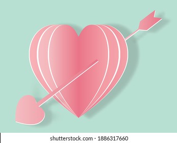 Pink heart with an arrow.Paper art concept.