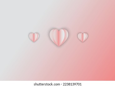 Un corazón rosa hecho de 3 hojas de papel.