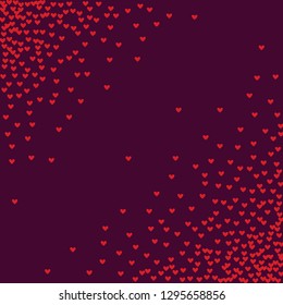 Pink hearts on a burgundy background. Heart confetti on a bright background. Valentine's Day.