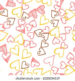 Pink hearts seamless pattern. Scattered little yellow, brown, rose love symbol.  Endlessly repeating fall sketch heart shape on white valentine background. Hand drawing texture. Vector illustration.
