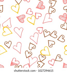 Pink hearts seamless pattern. Scattered little yellow, brown, rose love symbol.  Endlessly repeating fall sketch heart shape on white valentine background. Hand drawing texture. Vector illustration.