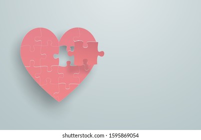 Pink heart-shaped puzzle That the last piece is going to be assembled with the main part Floating on a plain light green background, feel happy love in valentine