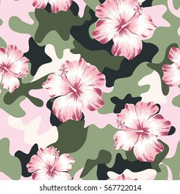 Pink hibiscus flowers and on the camouflage background. Vector seamless pattern. Tropical summer illustration.