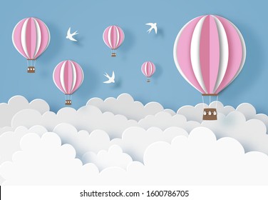 Pink hot air balloons with white clouds, birds and blue sky. Paper cut out digital craft style. Carving art. Vector illustration