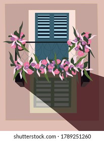 Pink house with balcony and flowers
