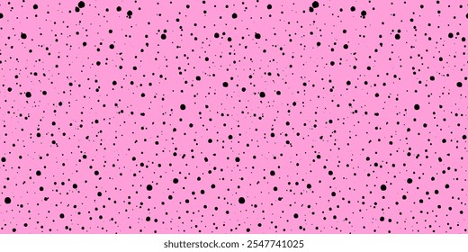 Pink ink splatter seamless pattern on a pink backdrop. Abstract spray grunge texture. Features scattered black dots with a speckled texture. Black explosion of paints. Hand drawn rose pastel backdrop.