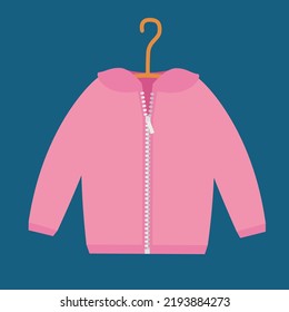 A pink jacket with a zipper hangs on a trempel