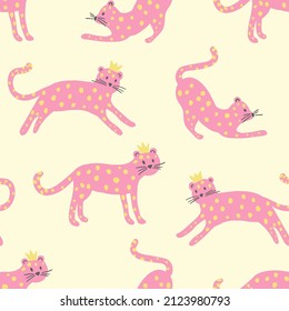 Pink leopards with yellow dots and small crown. Seamless pattern in cartoon style. Cute cats for kids textile and design. 