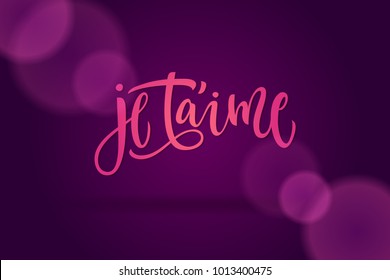 Pink letters I love you in french. Calligraphy on a dark violet background for cards, confession of love, invitations and banners. Modern brush calligraphy.