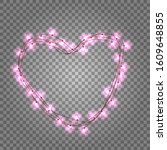 Pink light bulbs in heart shaped frame on transparent background. Holiday illumination made of garland wire for Happy Saint Valentine's day.