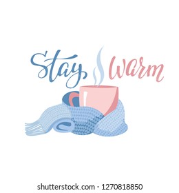 Pink mug with tea or coffee wrapped blue scarf. Hand drawn lettering inscription Stay warm. Flat cartoon style illustration