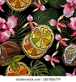 Pink orchid flowers, lemons, coconuts and palm leaves seamless pattern. Embroidery. Jungle paradise art. Fashionable template for design of clothes 