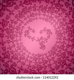 Pink ornament on circle with heart on the middle