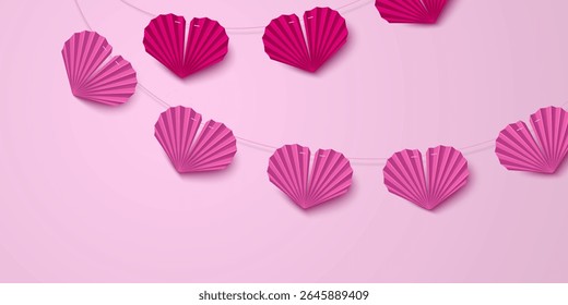Pink paper heart garland decoration with folded fan style shapes connected by string. Valentine Day party banner with romantic origami bunting for weddings, anniversaries or love themed celebrations.