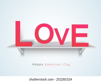Pink paper text love on glossy wall shelf for Happy Valentines Day celebration.