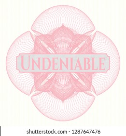 Pink passport style rosette with text Undeniable inside