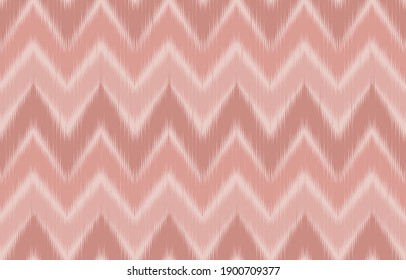 Pink pastel color tone control of zigzag chevron ikat fabric texture while is a vertical and horizontal seamless pattern. A vivid geometric wave of Ethnic, Boho fuzzy lines for cloth or room wallpaper