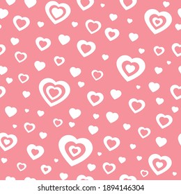 Pink pattern with hearts. Chaotic pattern hearts. Seamless vector pattern white hearts on pink background. Background for valentines day or card love.
