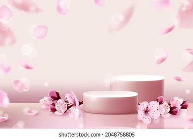 Pink pedestals with cherry blossoms and falling cherry petals and pink pearls on a pink pastel natural background. Fashionable subtle abstract promotion of cosmetic products.