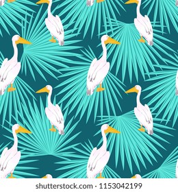 Pink pelican. Onocrotalus. Palm tree tropical seamless pattern.